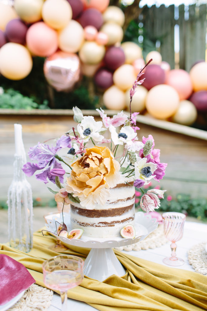 naked cake sugar flowers balloon garland